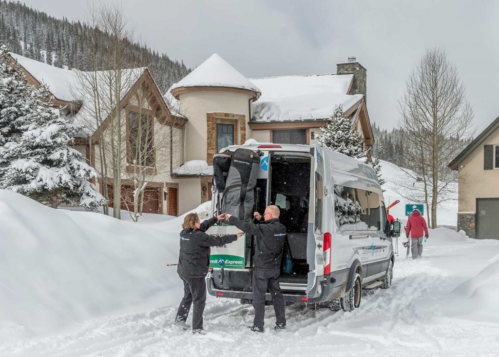 Summit Express Vans Winter Unloading Luggage